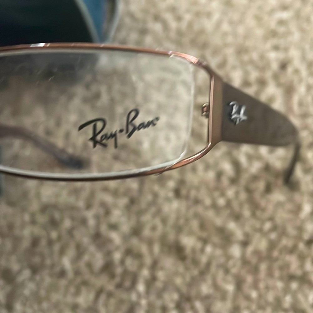 These Ray-ban glasses have never been wore an the temples are a brownish color